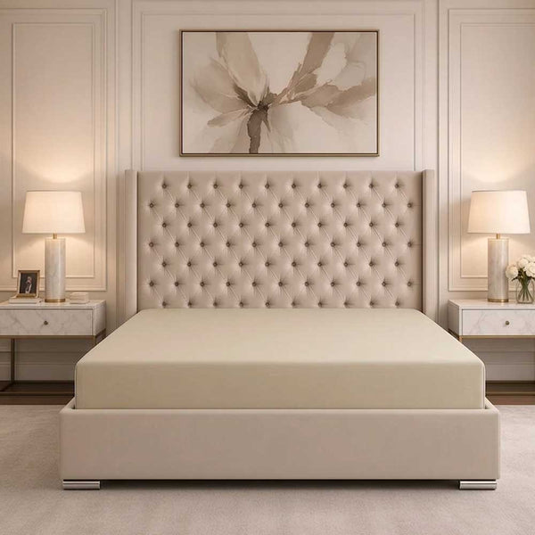 Champagne bamboo silk deep fitted sheet on a made bed
