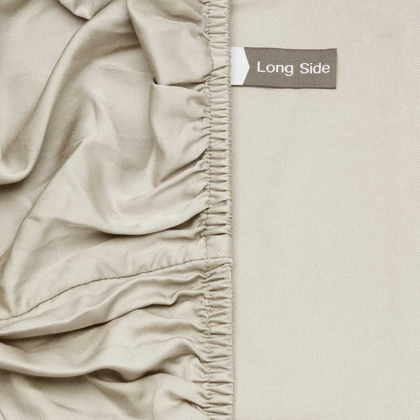 Long side label on the Champagne bamboo silk deep fitted sheet for easier bed making
