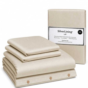 Luff SilverLining Champagne bamboo silk bedding folded beside its retail packaging
