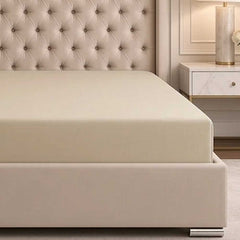 Elasticated corner of the Champagne bamboo silk deep fitted sheet wrapped around a deep mattress