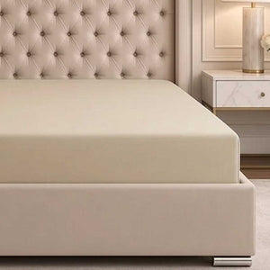 Elasticated corner of the Champagne bamboo silk deep fitted sheet wrapped around a deep mattress